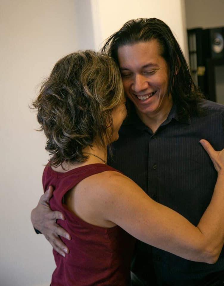 Eric sharing a tango embrace with a partner